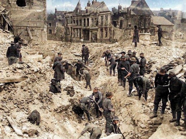 Australian soldiers clear debris after the explosion in the Town Hall in Bapaume on the night of 25-26 March 1917. 